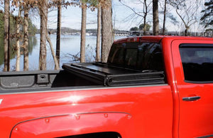 Lund 04-15 Nissan Titan (5.5ft. Bed) Hard Fold Tonneau Cover w/Bracket Kit - Black