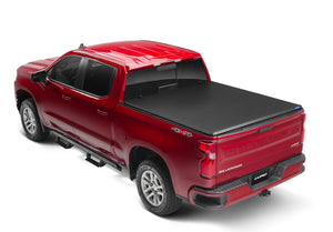 Lund 04-15 Nissan Titan (5.5ft. Bed) Hard Fold Tonneau Cover w/Bracket Kit - Black