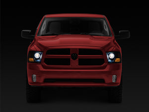 Raxiom 09-18 RAM 1500 Super White LED Halo Projector Headlights- Black Housing (Clear Lens)