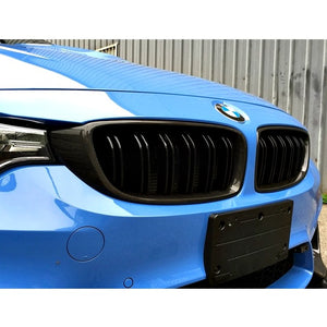 AutoTecknic Carbon Fiber Front Grilles on a blue BMW 