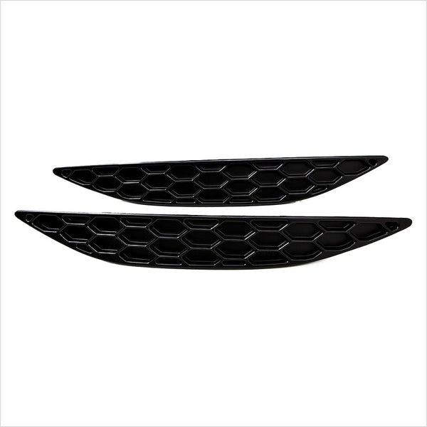 A set of gloss black Acexxon Honeycomb Rear Reflector Inserts for the VW MK7 Golf R