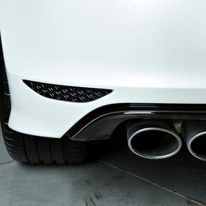 Close up of a white BMW with a gloss black Acexxon Honeycomb Rear Reflector Inserts