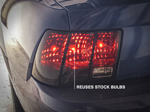Raxiom 99-04 Ford Mustang Excluding 99-01 Cobra Tail Lights- Black Housing (Smoked Lens)